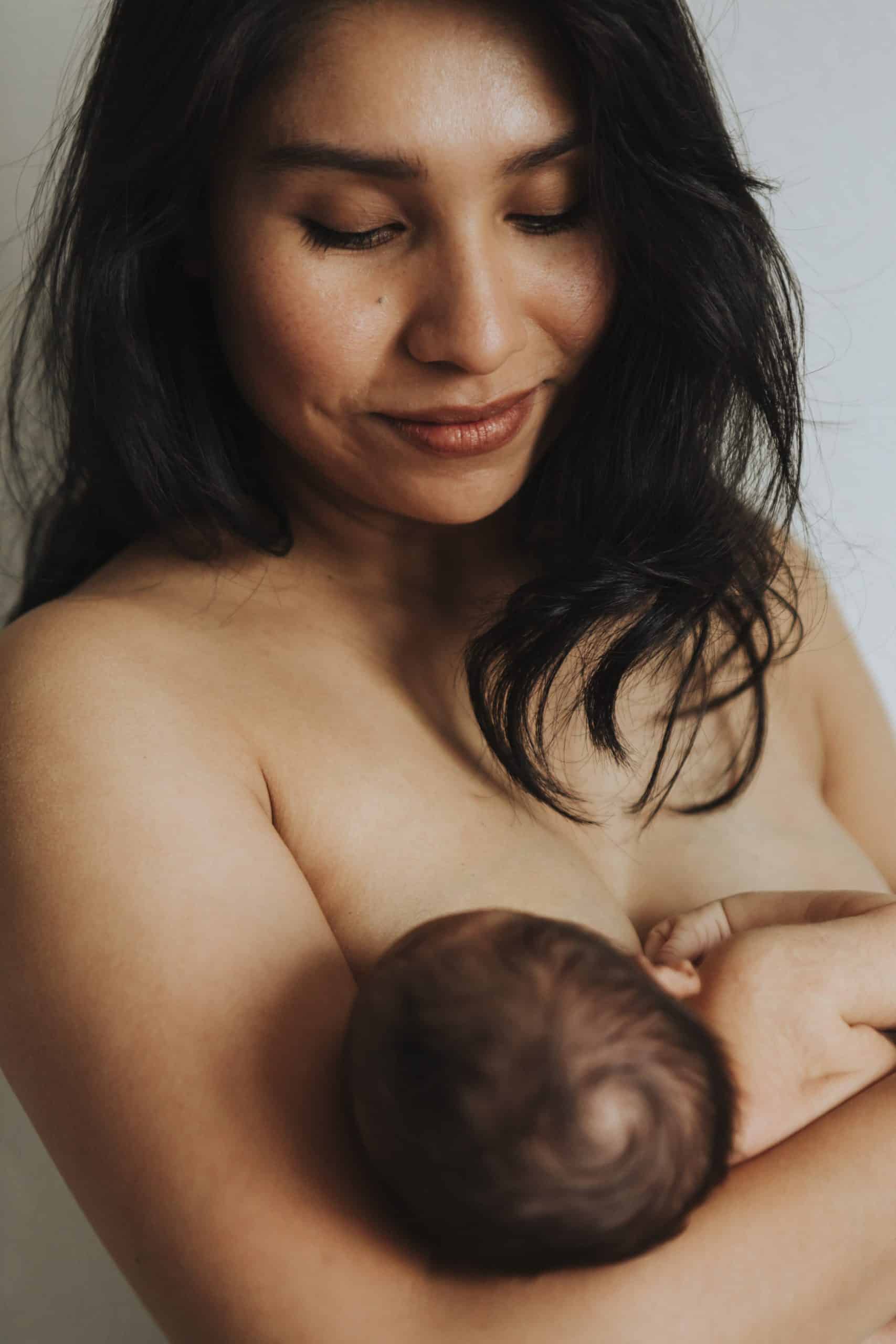 mother holding newborn baby