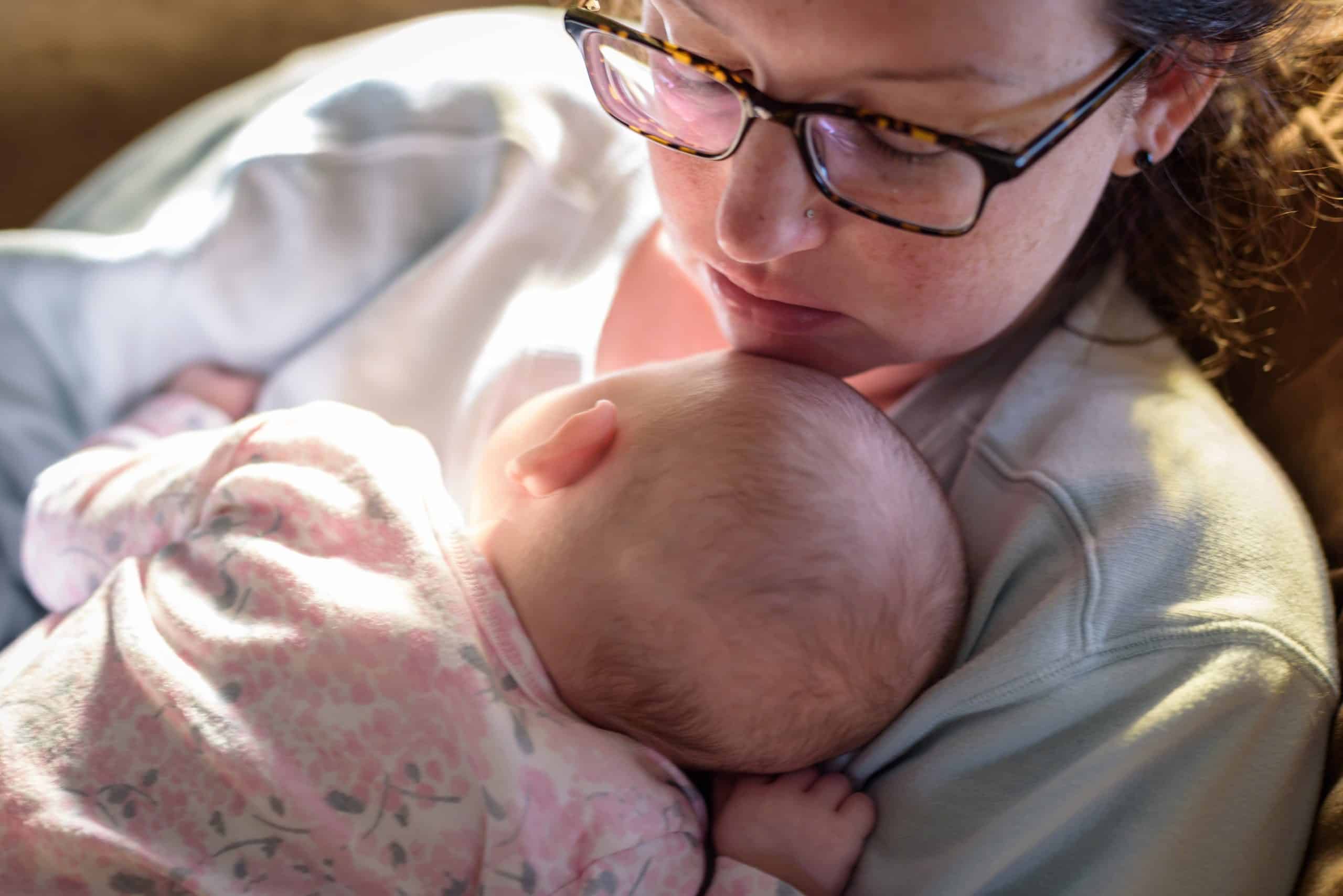 tired-new-mom-catching-up-on-sleep-while-baby-is-n-2023-11-27-04-57-00-utc