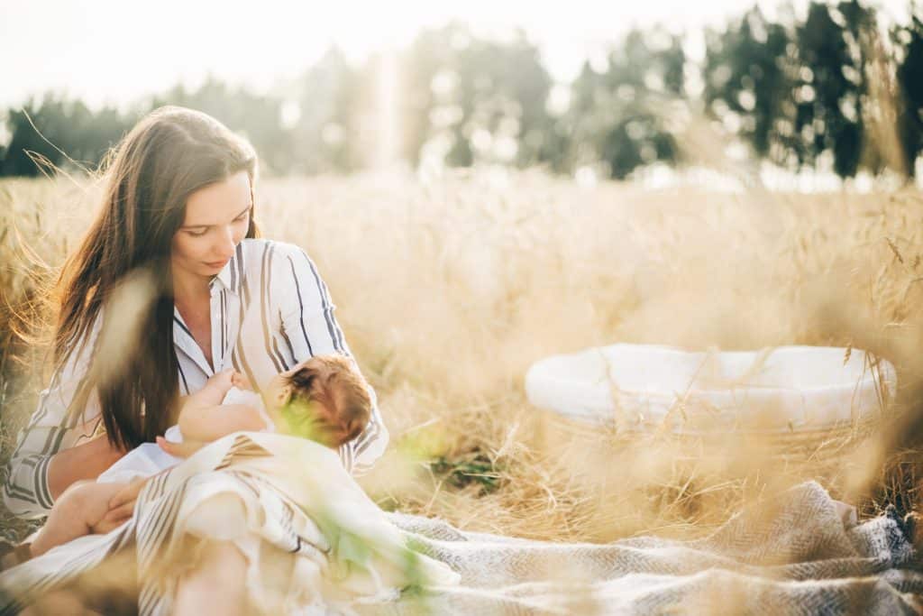 feeding baby nursing outdoors