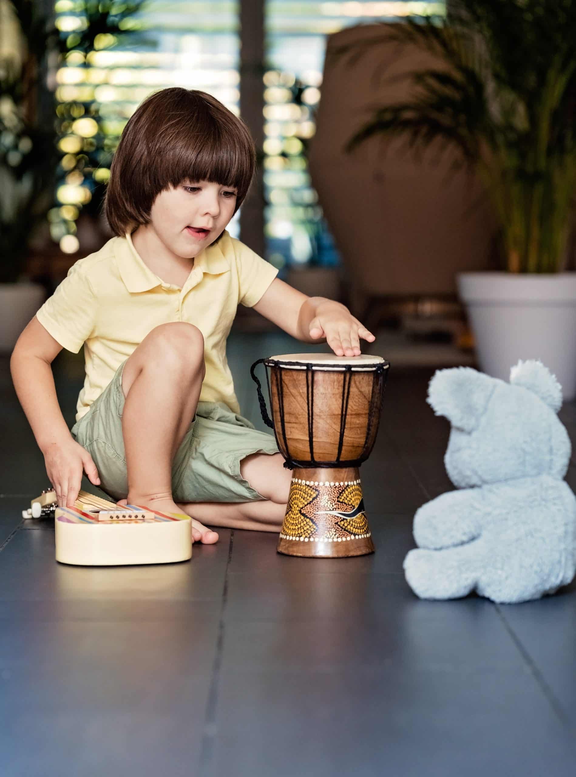boy drumming, using music to regulate the mood