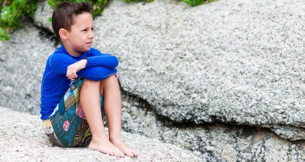 child sitting outside 