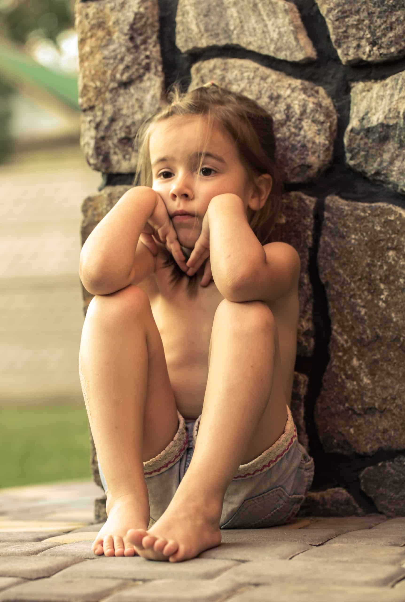 sad child in time out disclipine naughty corner 