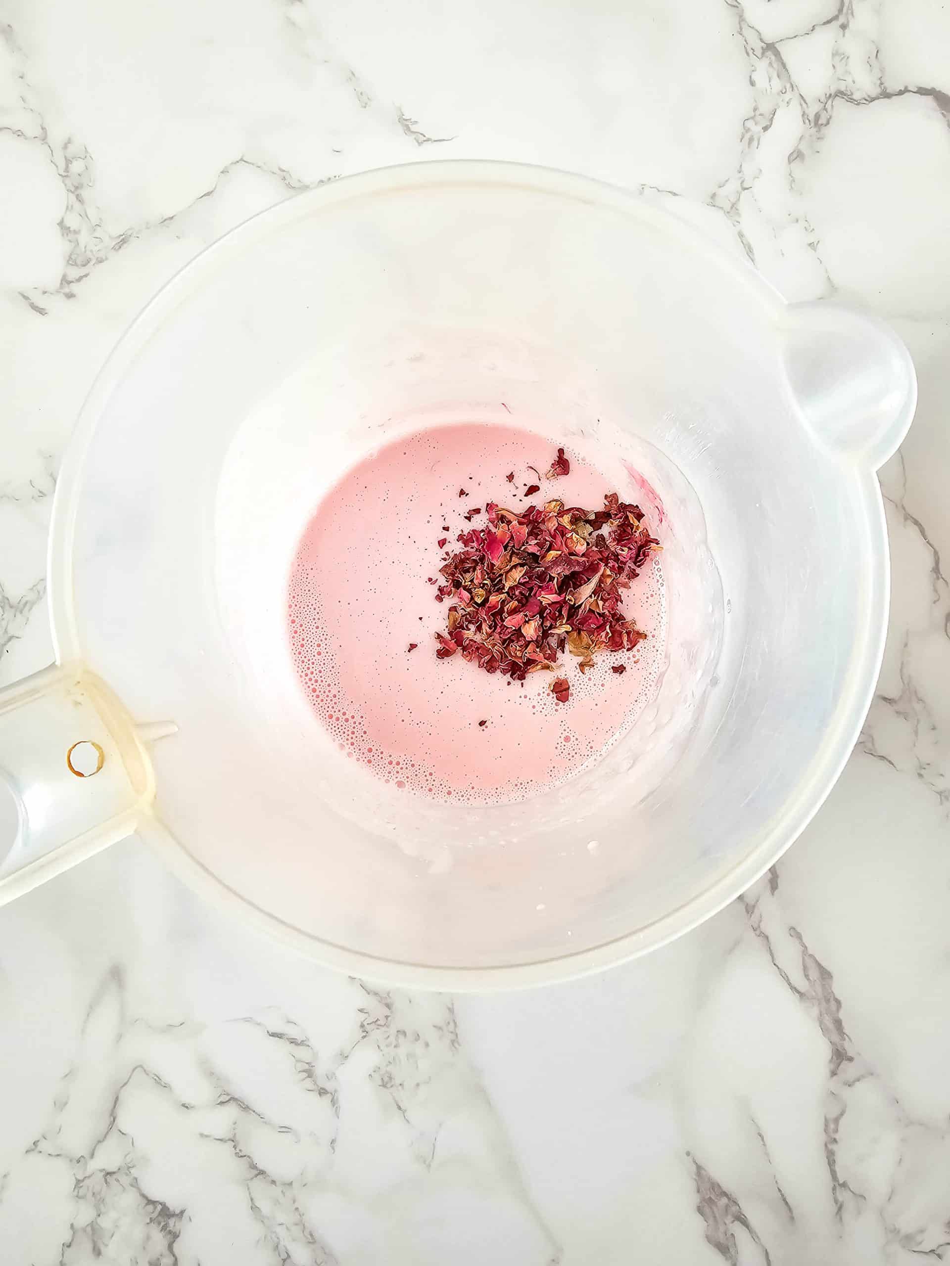 mixing rose petals in soap