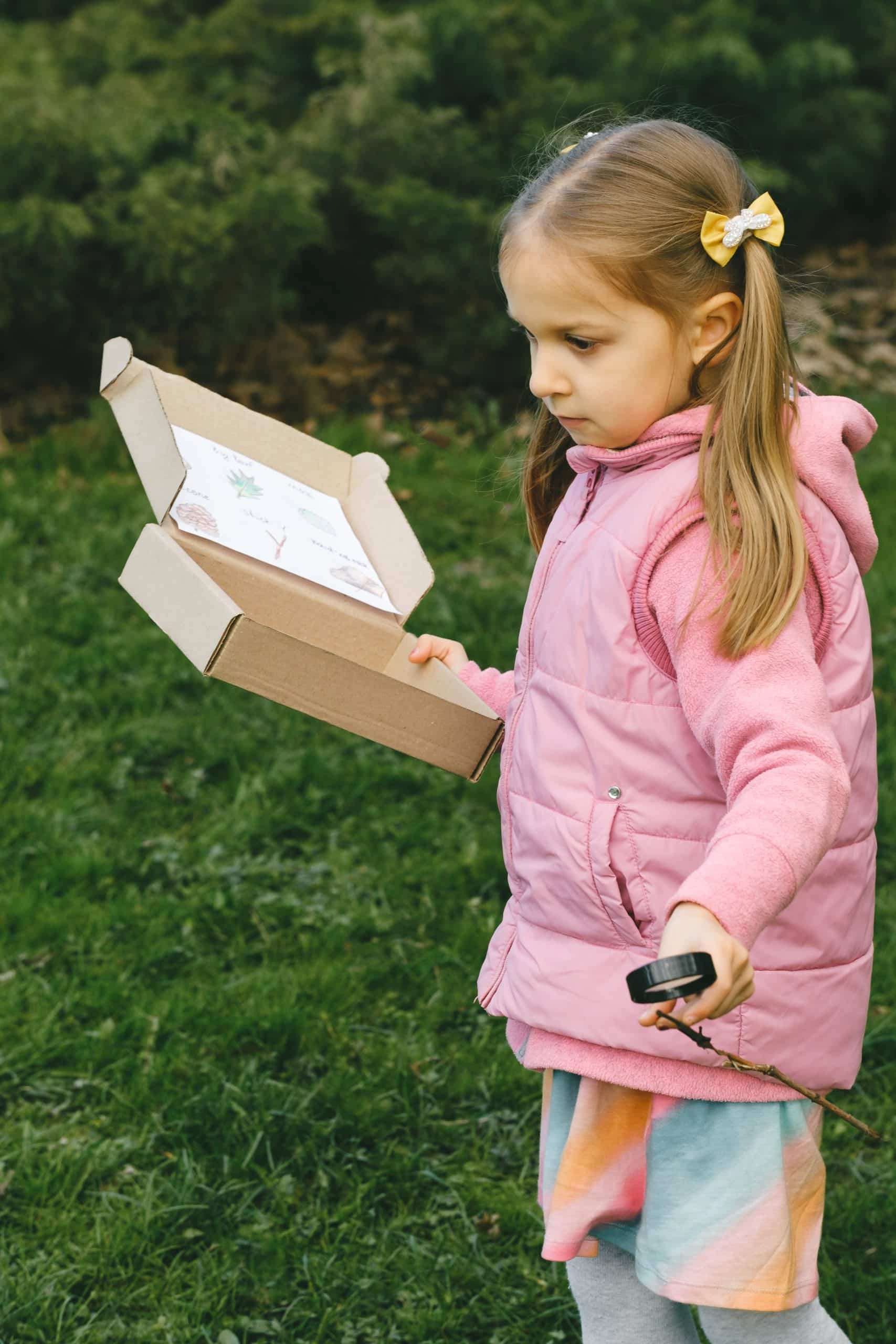 child with nature scavenger hunt box